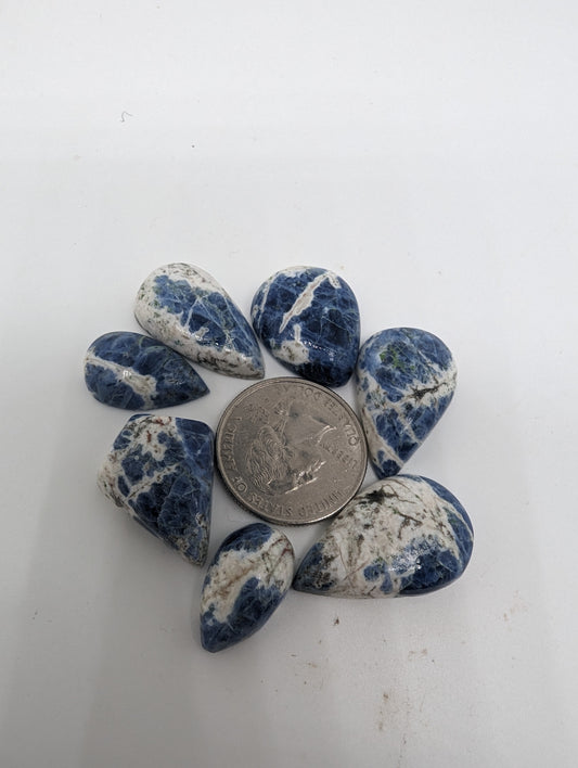 Porcelain Sodalite - 7pc Pear Cabs - 112.30cts(22.47g)