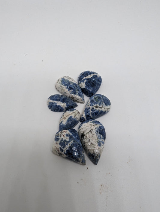 Porcelain Sodalite - 7pc Pear Cabs - 112.30cts(22.47g)