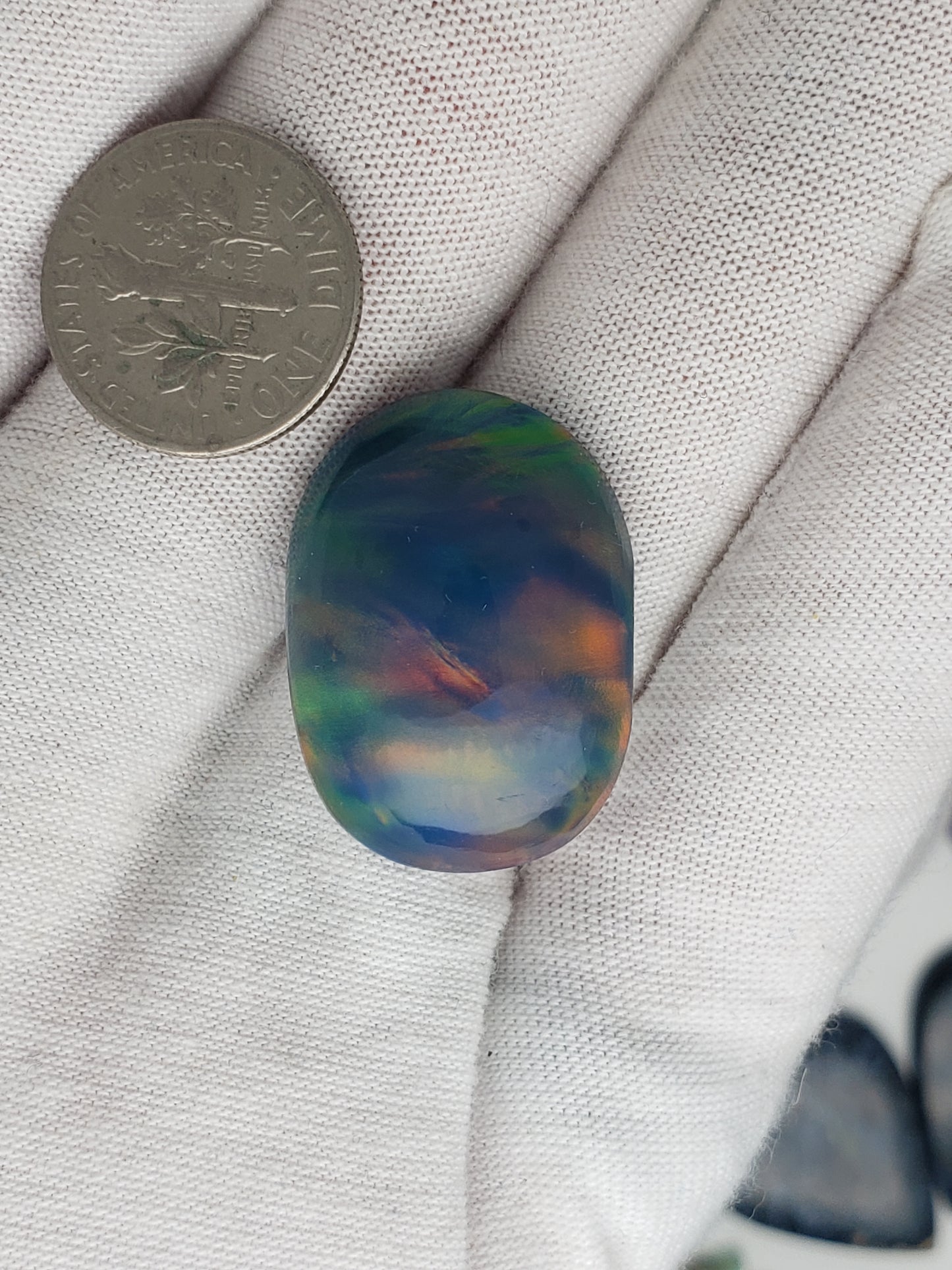 Aurora Opal (Dan Omen cut) 14.7 carat - oval medium dome - 27.4mm